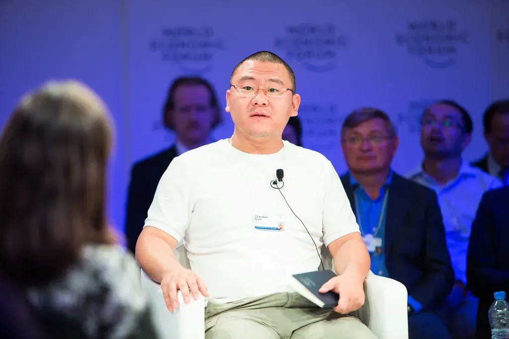 Chandler Guo seated at the World Economic Forum’s 2016 meeting in Tianjin