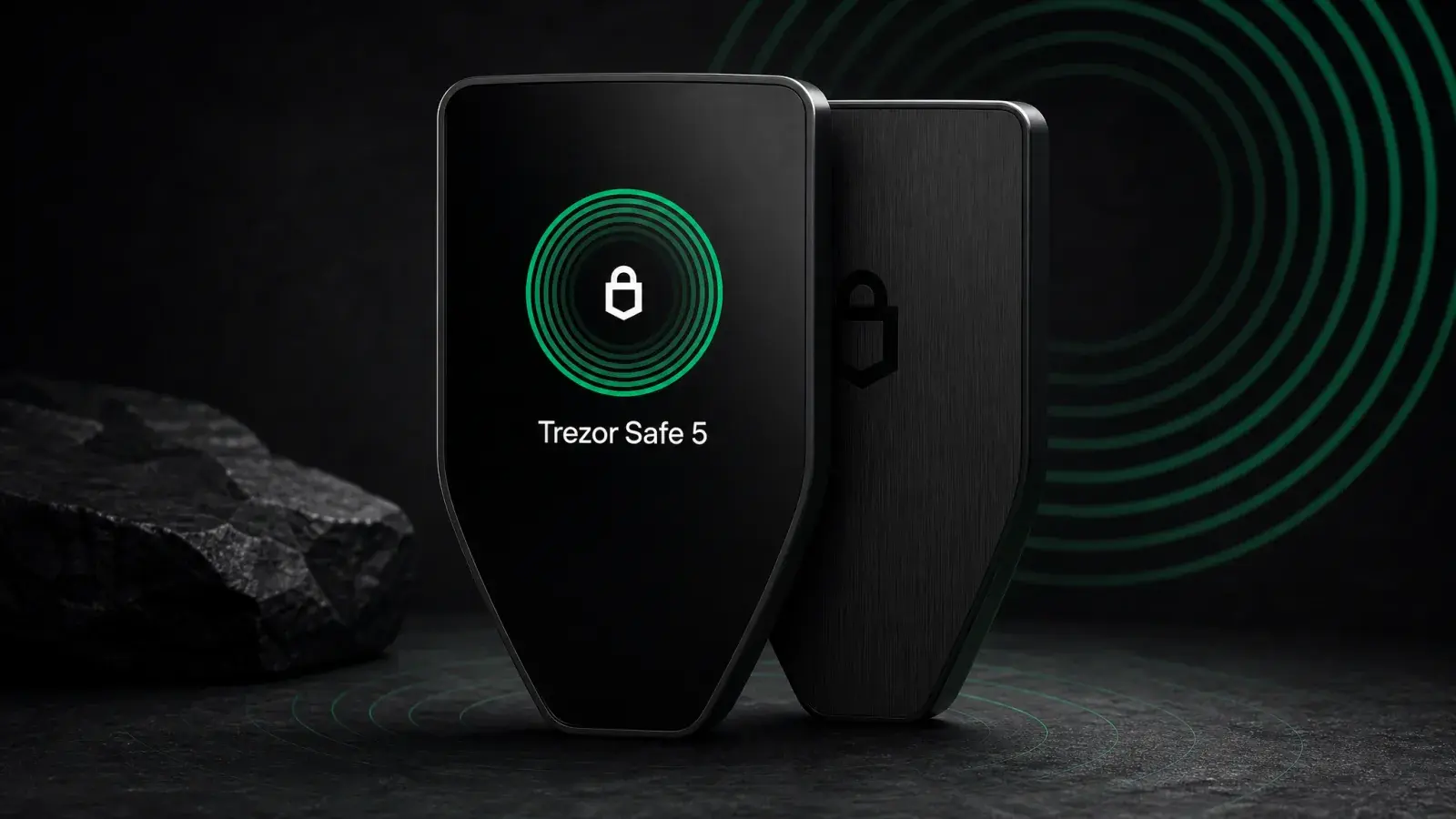 Trezor Safe 5 touchscreen hardware wallet in a charcoal and emerald security scene