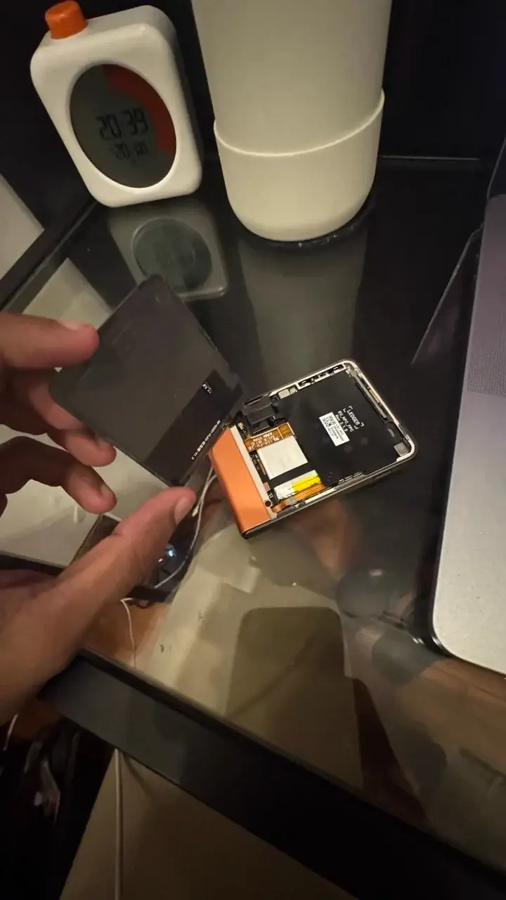 Opened Ledger device photographed at a table by a buyer reporting a purchase from Challenger at VivoCity, Singapore